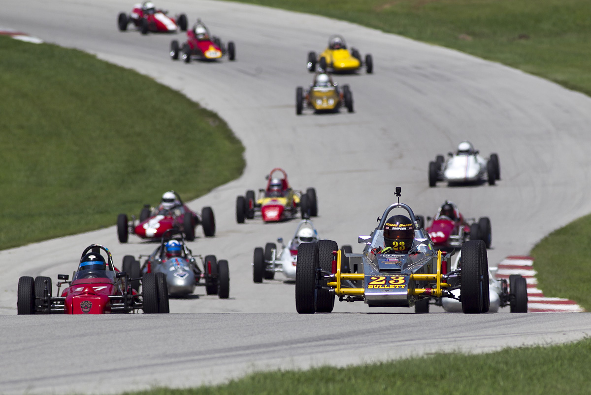 A pack of Formula Vees charging up the hill at Hallett